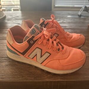 New Balance Orange and White Athletic Shoes with Iconic Design